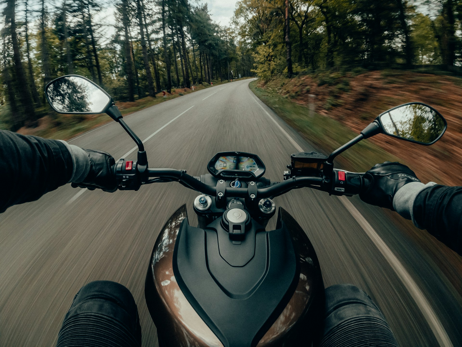 a motorcycle rider on a road